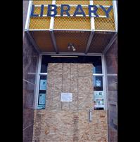 Robbers steal donations, smash door to Ronan library