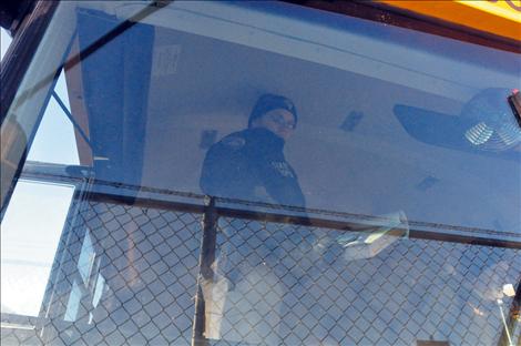 Montana Highway Patrol Trooper Shad Andersen inspects the Ronan fleet of school buses.