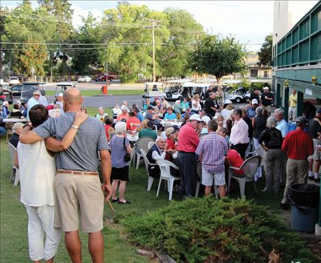Friends gather at Polson Bay Golf Course Sept. 2 to honor golf pro Roger Wallace.