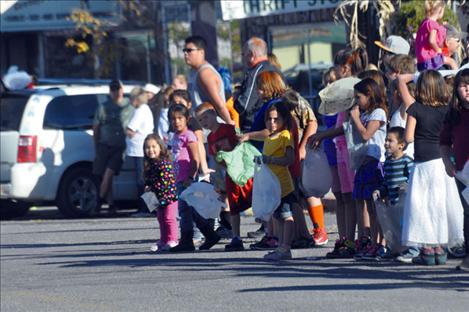 People wait in  anticipation of the 2014 Ronan Homecoming Parade Lineup. 