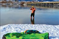 Longtime swim coach trains for winter open water events