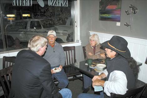 Local residents discuss election issues after the forum.