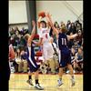 Freshman Phillip Malatare shoots above Viking hands in Thursday’s rival game.