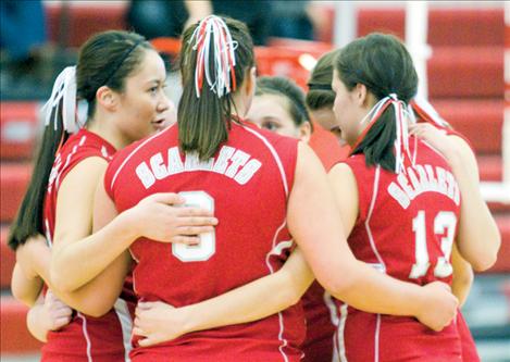 The Arlee Scarlets huddle during their game against Noxon last Friday at the District 10-C tournament in Arlee.