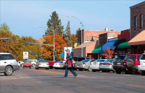 Clothed in fall colors, downtown Polson is a sight to see. Busy pedestrians and vehicle traffic are proof positive that shoppers visit the area.