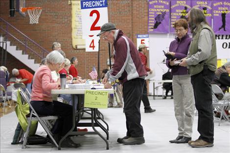 Voters wait for ballots Tuesday in Linderman Elementary's gym, the polling place for Polson residents.