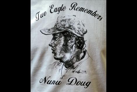 Long-time Two Eagle River School employee Rod Bird wears a T-shirt with Doug Morigeau’s likeness. The original sketch of “Nunu Doug,” as he was known by TERS students, was drawn by a former art teacher and displayed in Cheryl Morigeau’s office.