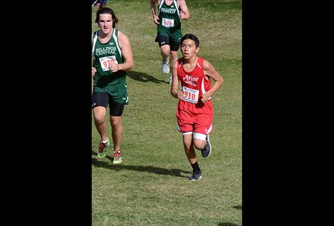 The Arlee Warriors finished in fourth place at Saturday’s King Ranch Invitational 2-mile run. Left, Warrior James Crazyboy runs at the Mountain West meet in Missoula in September.