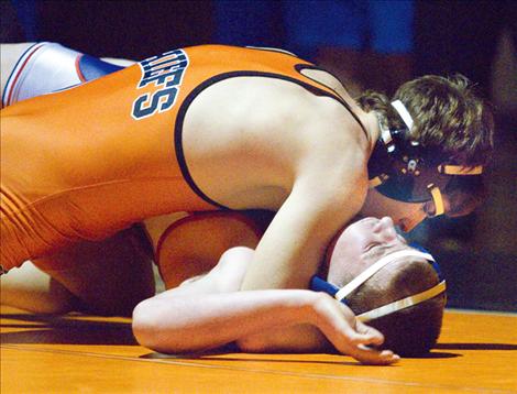 Ronan’s Colby Roberts, the 2013 189-pound state champion, pins a Mission-Charlo opponent earlier this season.