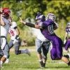 Vikings’ Brock Tomlin blitzes the Warrior quarterback.