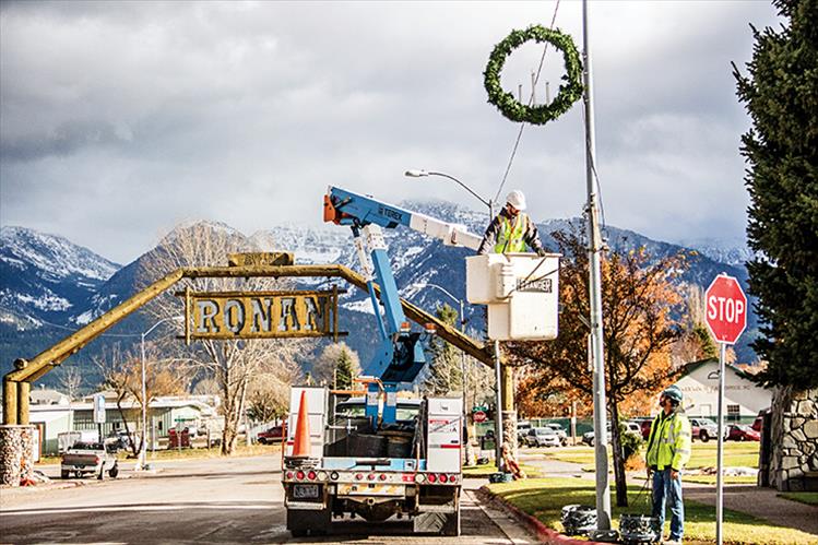 Access Montana employees once again put up holiday lights on Main Street in Ronan.