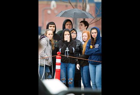 Ronan High School students react to a mock crash scene during a Ghost Out event.