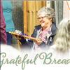 Ernie Ducheneaux receives a breadboard after a dozen years of volunteering as a board member with the Ronan Bread Basket.