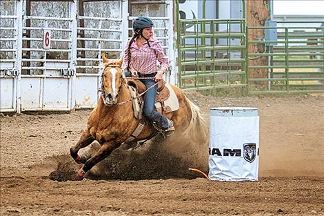 Hailey Weible looks at a first-place finish during the barrels event.