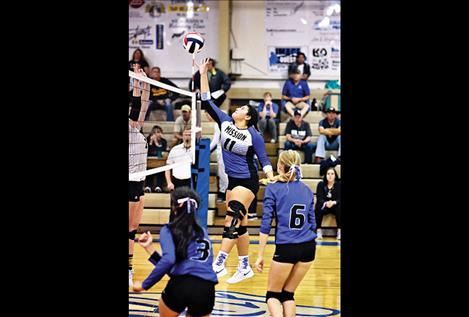 Lady Dawg Addison Arlint taps  one over the net.