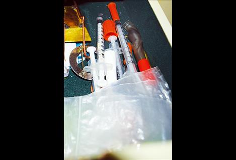 Polson Police  Department officers find drug paraphernalia after serving a search warrant in Polson.