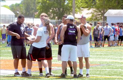 UofM football players assisted Ronan's football camp.