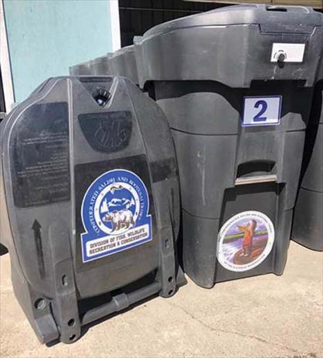 Examples of 65-gallon bear-resistant garbage cans, available through the Confederated Salish and Kootenai Tribes' Wildlife Management Program.
