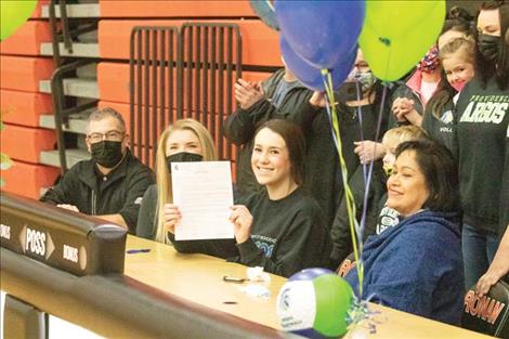Madeline McCrea celebrates her signing with the Argos.
