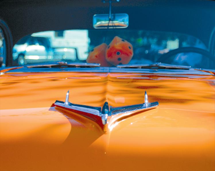 The hood ornament on Tim Arneson’s ‘55 chevy shines in the sun.