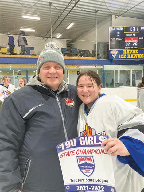 Proud dad Chad Newman and Flathead Lady Fusion goalie Summer Newman celebrate a 2021-2022 MAHA 19U State Championship. 
