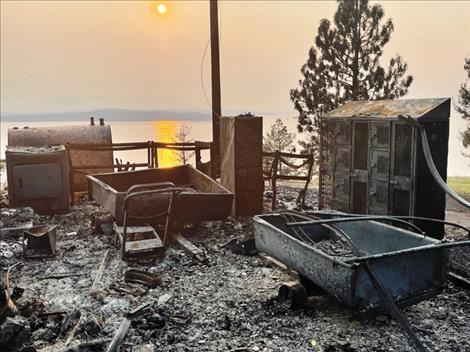 Pictured at left was all the remained of one of the 14 homes destroyed by the Boulder 2700 fire last summer. The fire forced the evacuation of over a hundred families and burned for over a month.