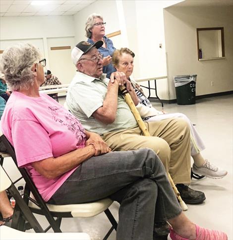 Jan Tusick urges county commissioners to find middle ground on disputes with irrigation districts during a meeting Aug. 30 in Ronan. 