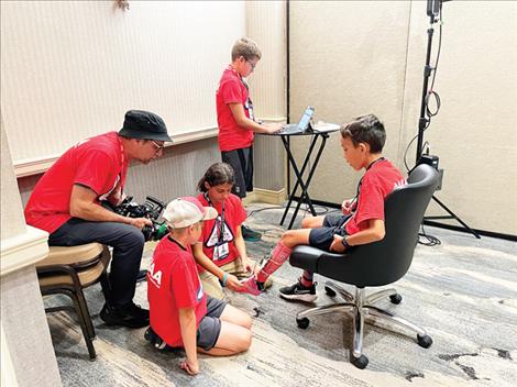 Students were designing astrosocks for astronauts to use in space to relieve pressure as they use the top of their feet to move around in the International Space Center top: Brandtly Caye, Cameraman, Isabella Heredia, Vance Means in chair, Owen Shirtliff
