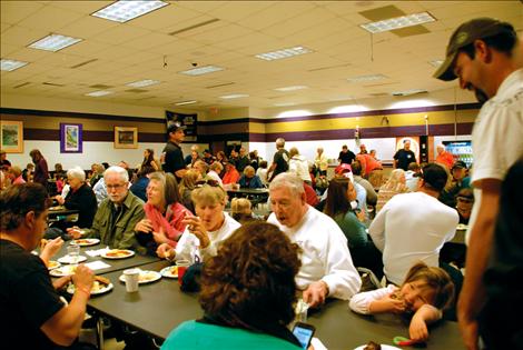 A crowd packs the room in support of Bella and Bridger.