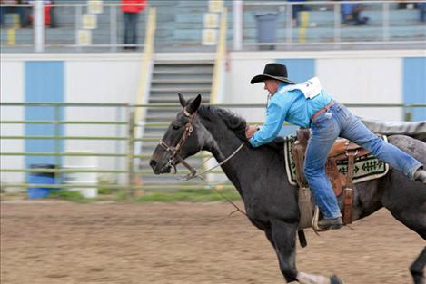 Robert Rider jumps off his horse during the goat tying competition at the junior high state rodeo last weekend. He won the event.