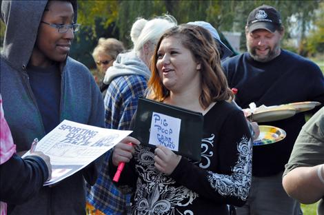 Samantha Darr takes donations for pig pie bingo.