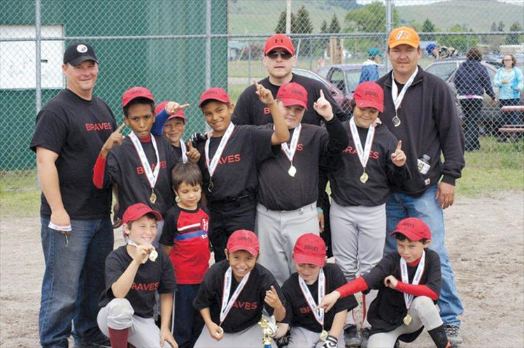 The Ronan Braves Little League baseball team celebrates after winning the Mission Valley Minors Tournament June 1-3 in Arlee. Back row, left to right, are coaches John Dolence, William Croft, and Doug Mays. Middle row, left to right, are Girma Detwiller, James Bennett, Darian Williams, Hunter Jore and Justin Mays. Front row, left to right, are Eric Dolence, Ariam Croft, Sheadyn Croft, Dylan Davis and Caden Rhine.