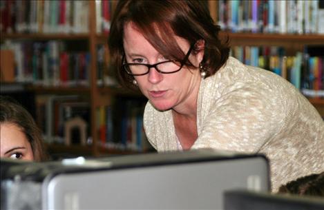 Anna Baldwin and a student work together during one of Baldwin’s English classes at Arlee High School. Baldwin was presented with the Teacher of the Year award on Oct. 17 in Bozeman. 