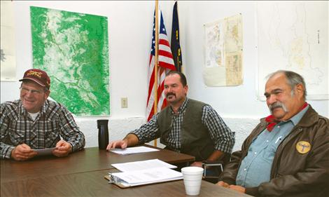 FJBC board members Wayne Blevins, left, chair Boone Cole and Jerry Laskody speak with reporters on Oct. 15.