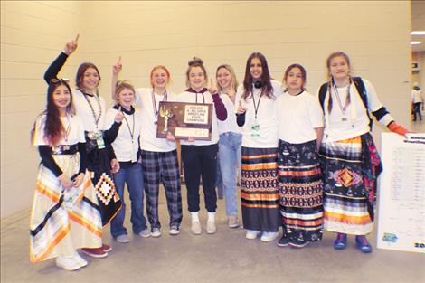 The Ronan High School Girls Wrestling Team poses for a photo with their State Championship trophy. Right:  Ronan’s Tirza Two Teeth was the Overall Girls State Champion.