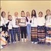The Ronan High School Girls Wrestling Team poses for a photo with their State Championship trophy. Right: Ronan’s Tirza Two Teeth was the Overall Girls State Champion.