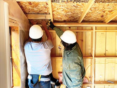 Students installing insulation