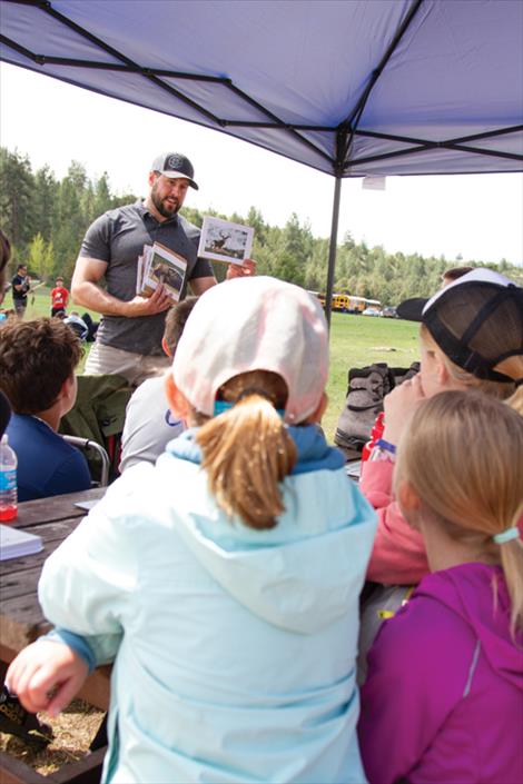 Todd Espinoza, with CSKT’s Wildland Receation Program, asks students which animal they think has the best and worst sense of smell. Of the options given, students accurately guessed that a bear has the best and a human the worst. A bear, Espinoza pointed out, has a sense of smell 21,000 times better than a human.