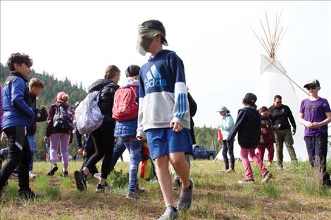 At the Tribal Fish and Game station, students pretended they were bears searching for food. Some bears had limitations, like the “blind bear” above. Students learned that a bear needs 80 pounds of food to survive for 10 days.