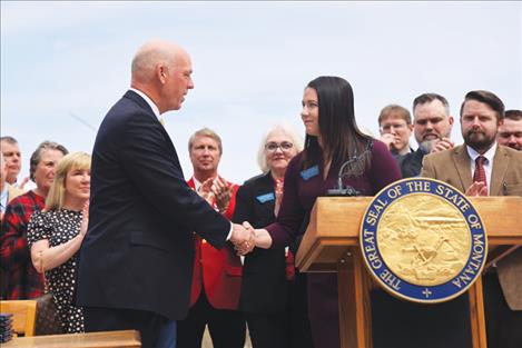 Gov. Gianforte shaking hands with Rep. Sprunger, the bill’s sponsor, at a May 2023 ceremony.