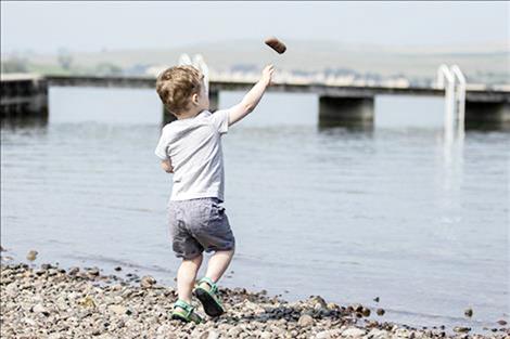 Zander Avison heaves a few practice rocks into the lake at the last competition in 2019. 