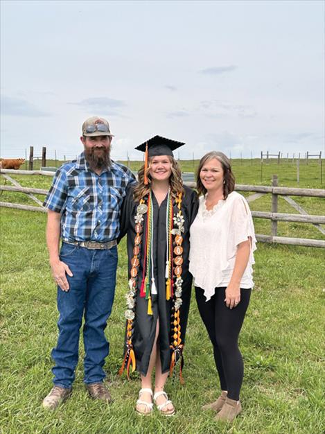  Eighteen years later, Hailey Hakes is a member of the 2023 Ronan High School graduating class. She is pictured below, center, on graduation day with her father Brandon, and her mother Natasha.