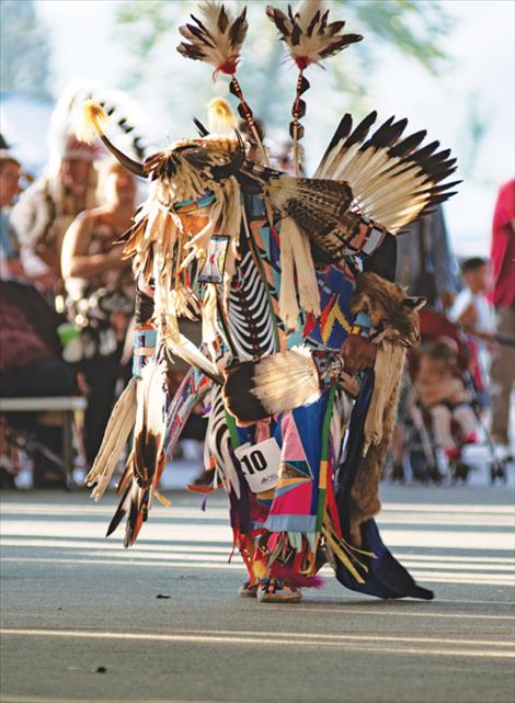 The Arlee Esyapqenyi has been held nearly year for decades. This dancer took to the floor in 2019, donning impressive regalia.