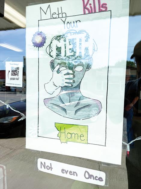 Kailyn Marengo, Anastasia Hertz, and Rayna Tonasket painted a pair of posters located on the Access Montana Building in Ronan.