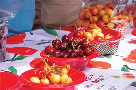 Samples of locally grown Sweet Red and Rainier cherries were available for customers at a vendor booth.