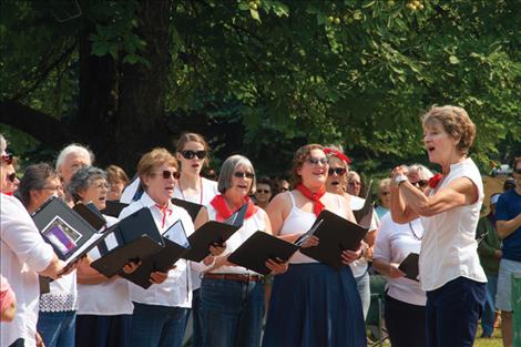 Mission Valley Choral Society members under the direction of Cathy Gillhouse sing the National Anthem during the Presentation of Colors.