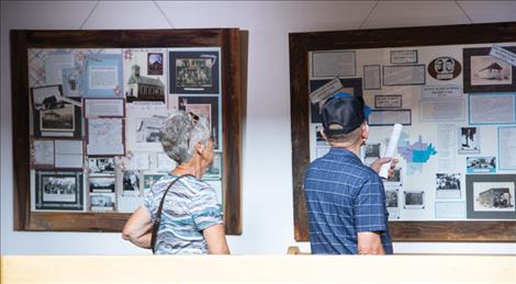 Centennial attendees view the historic displays of county schools on the third floor of the Lake County courthouse.