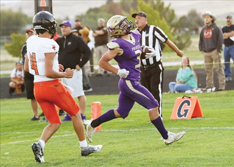 Tommy Sherry runs in a touchdown after an interception during the Sept. 15 homecoming football game. Below: the Lady Pirates won the “Battle for the Paddle” in their rivalry match up with the Ronan Maidens last Saturday, 3-1.