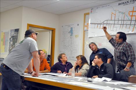 Members of the Ronan City Council look at numerous maps of the proposed Highway 93 expanison.  