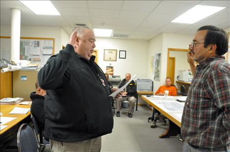 Ronan Chief of Police Valent Maxwell takes an oath of office administered by Mayor Kim Aipperspach. 